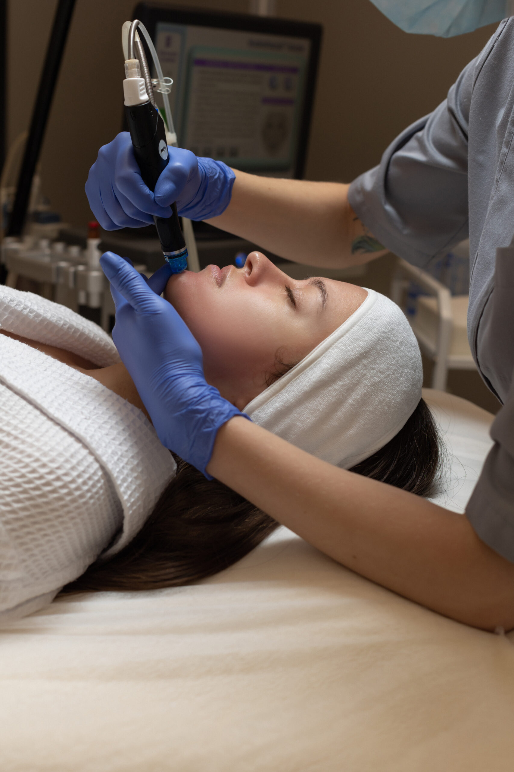 Woman receiving hydrafacial treatment at The Spa at Wellington